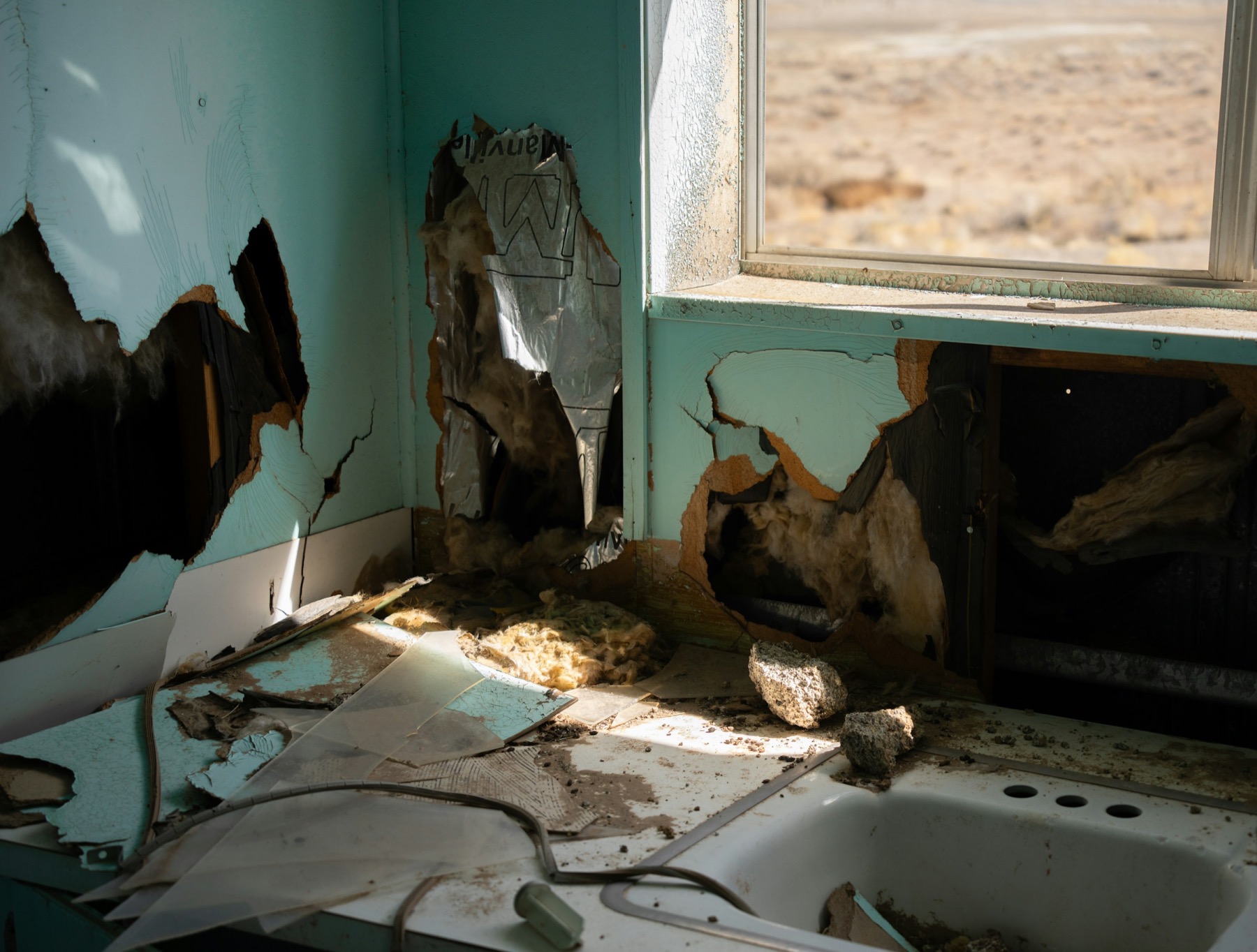 Water damaged interior wall and window materials after a serious leak